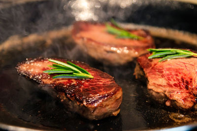 Close-up of meat on barbecue grill