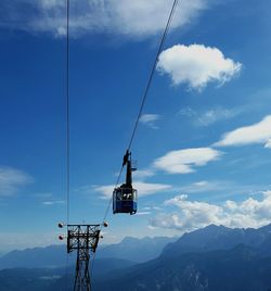 Overhead cable car against sky