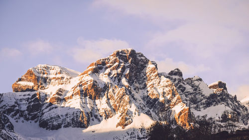 Panoramic view of snowcapped mountains against sky