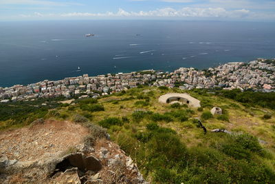 High angle view of buildings by sea