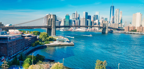 View of bridge and buildings against sky