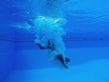 Woman swimming underwater