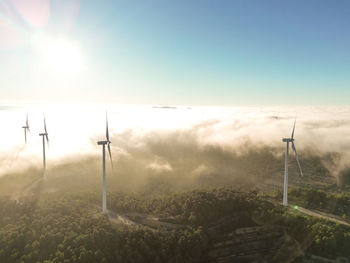 Aerial view of windfarm at foggy sunset