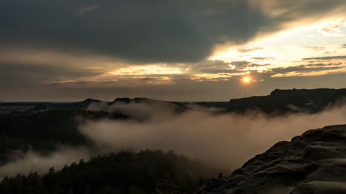 Scenic view of mountains against sky during sunset