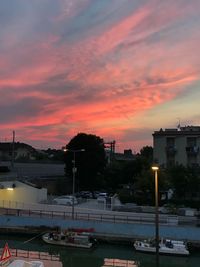 High angle view of city against sky at sunset