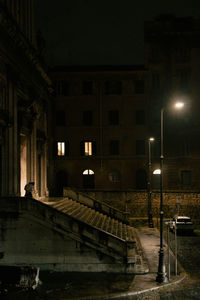 Buildings in city at night