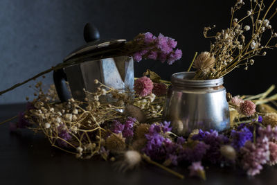 Close-up of purple roses in vase on table