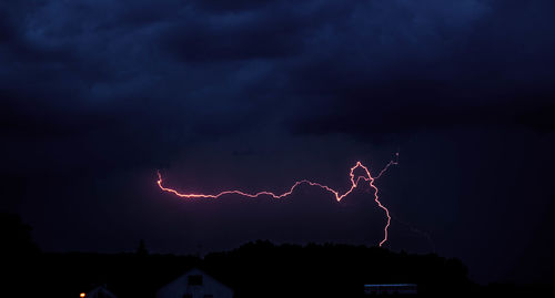 Low angle view of lightning in sky at night