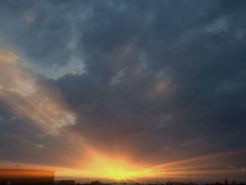 Scenic view of cloudy sky at sunset