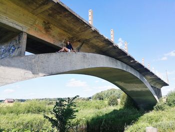 Woman on bridge under construction