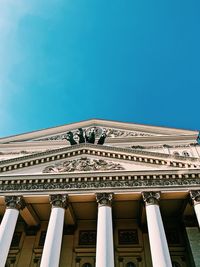 Low angle view of historical building against blue sky