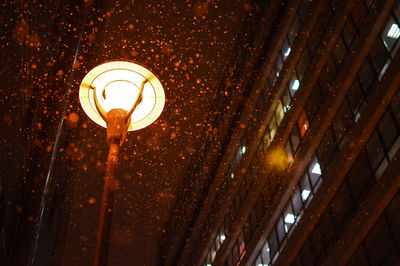 Low angle view of illuminated street light at night