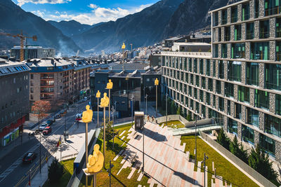 Cityscape of andorra la vella capita city of andorra wit men sitting on poles