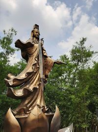 Low angle view of statue against sky