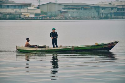 Men in boat on sea