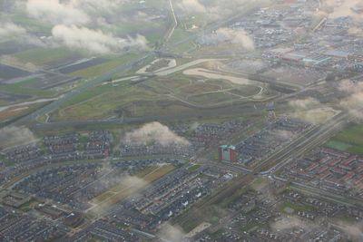 Aerial view of cityscape against sky