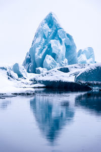 Scenic view of frozen lake against sky