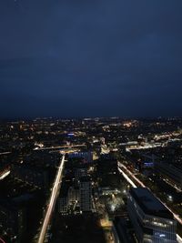 High angle view of illuminated buildings in city at night