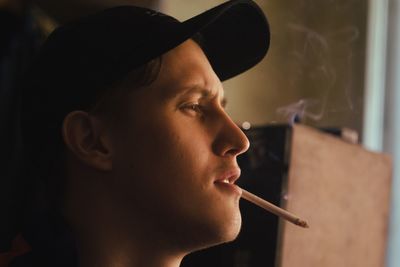 Portrait of man smoking cigarette