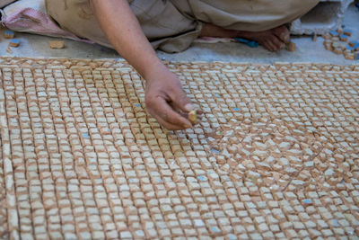 Low section of man preparing food