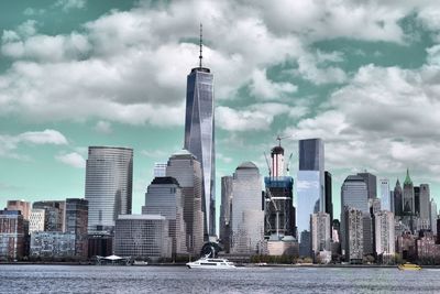 View of skyscrapers against cloudy sky