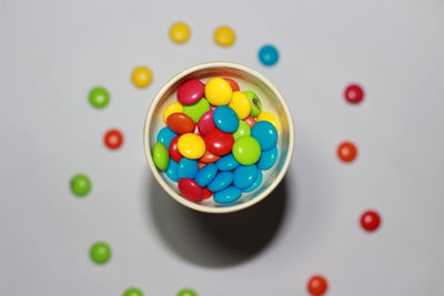 High angle view of multi colored candies on table