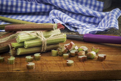 Fresh organic rhubarb on wooden background