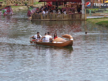 People on boat in lake