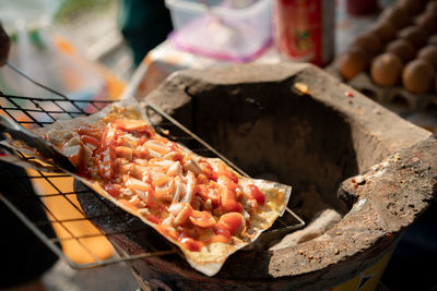 Close-up of meat on barbecue grill