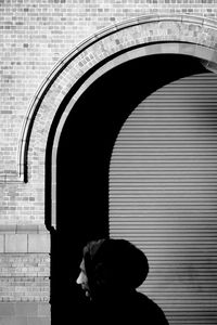 Portrait of silhouette woman against wall