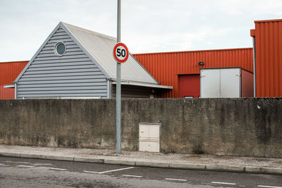 Road sign against sky