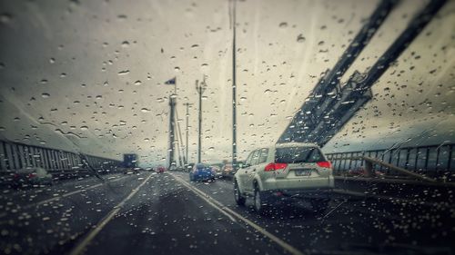 Road seen through wet glass