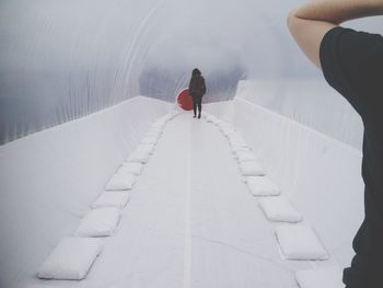 Full length of people walking on road