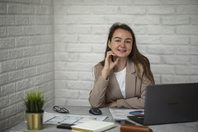 Manager moment, snapshot of success as vibrant young businesswoman smiles, fully engaged in office