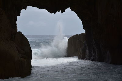 Scenic view of rock formation in sea