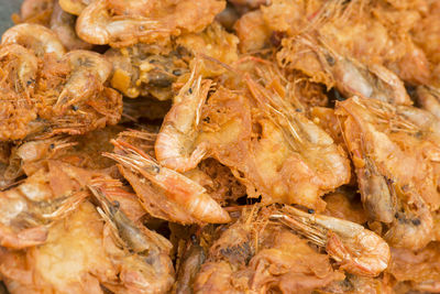 Close-up of fried prawns for sale in market