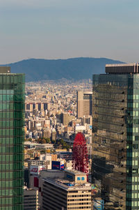 High angle view of buildings in city against sky