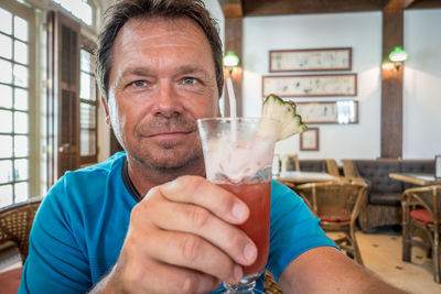 Close-up of man with drink