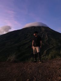 Full length of man standing against mountain