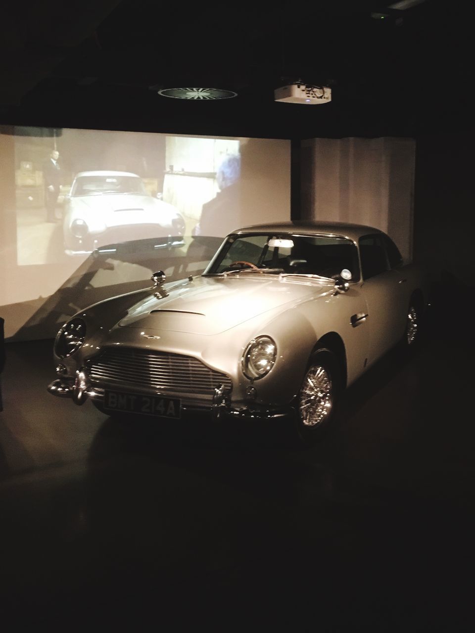 VIEW OF CAR IN ILLUMINATED ROOM