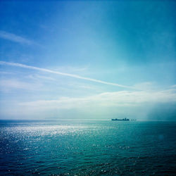 Scenic view of sea against blue sky