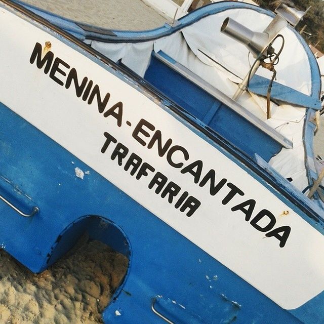 text, transportation, mode of transport, western script, communication, high angle view, blue, part of, nautical vessel, water, cropped, day, close-up, no people, guidance, travel, number, outdoors, boat, information sign