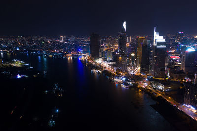 High angle view of illuminated city buildings at night