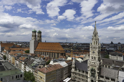 Cityscape of munich against cloudy sky