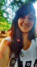 Close-up portrait of a smiling young woman