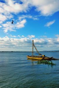 Boat in sea against sky
