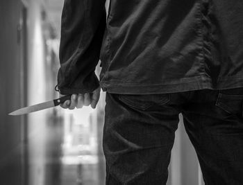 Close-up of man holding umbrella