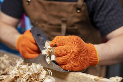 Midsection of man preparing food