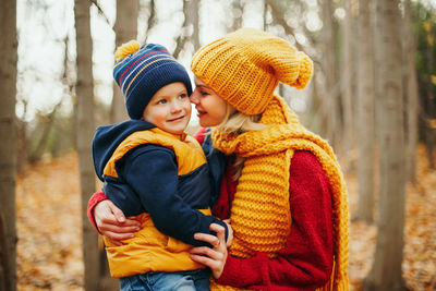 Mother and daughter in park during winter