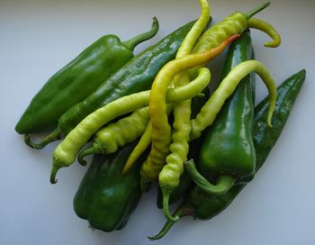 High angle view of green chili peppers